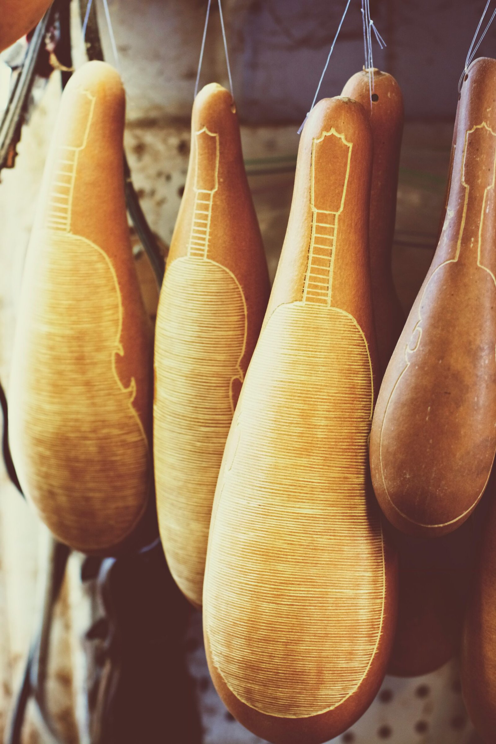 A row of wooden shoes hanging from hooks